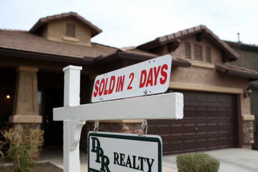 A sold sign is posted in front of a home in Phoenix.