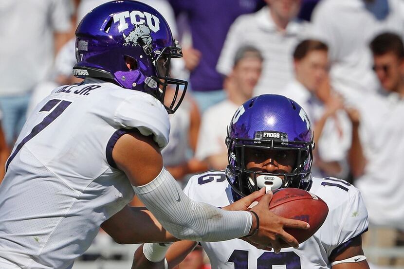 TCU Horned Frogs quarterback Kenny Hill (7) hands off to running back Kenedy Snell (16) in...