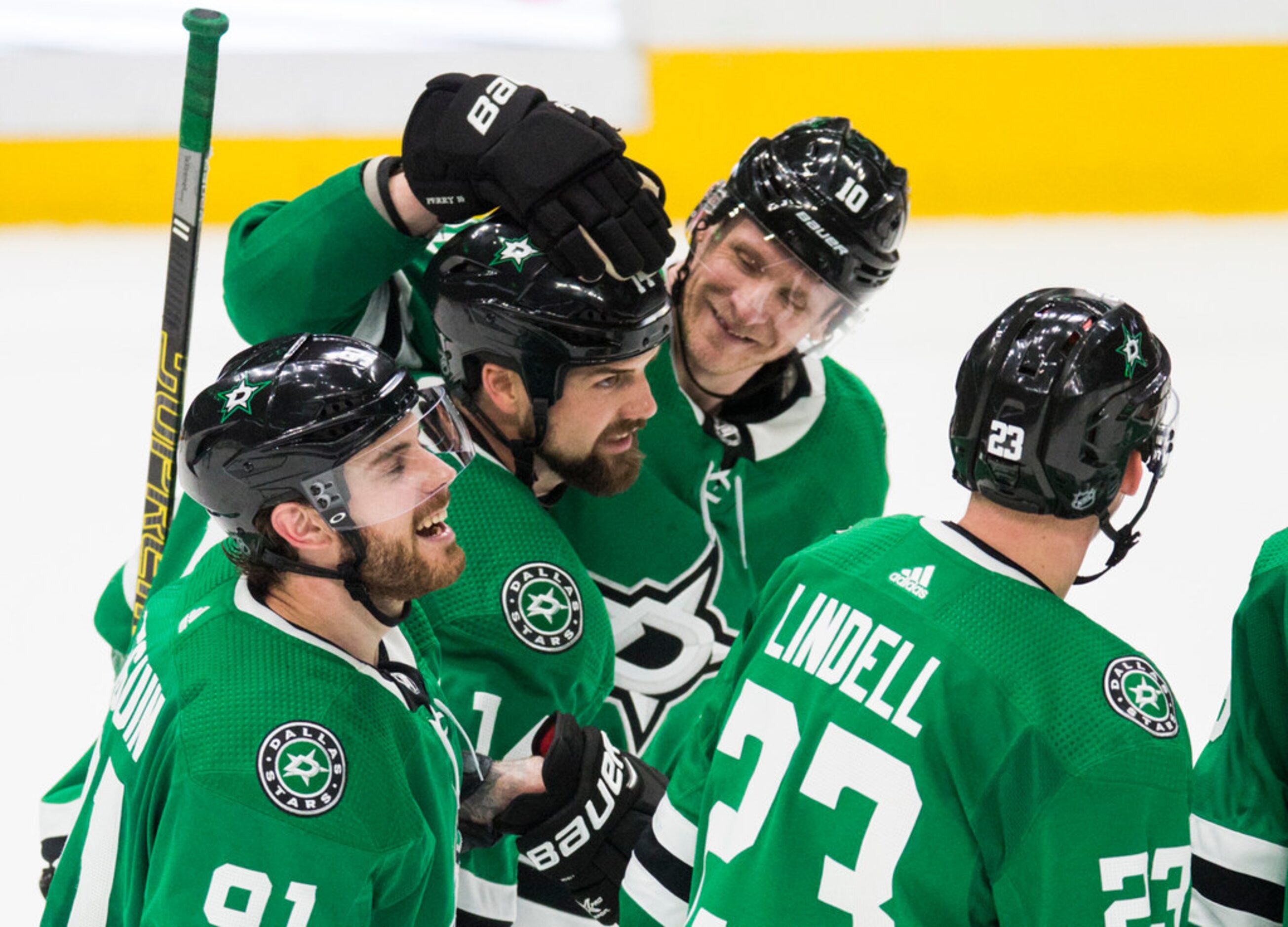 Dallas Stars celebrate a goal scored by left wing Jamie Benn (14) for a hat trick during the...