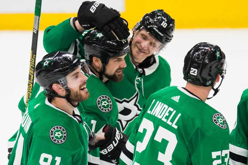 Dallas Stars celebrate a goal scored by left wing Jamie Benn (14) for a hat trick during the...
