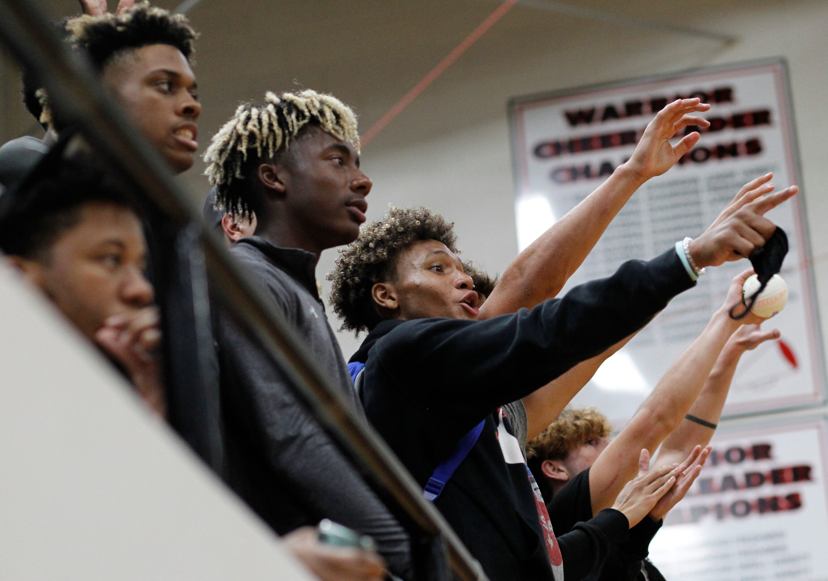 Arlington Martin fans react to a point scored during the second set of their match against...