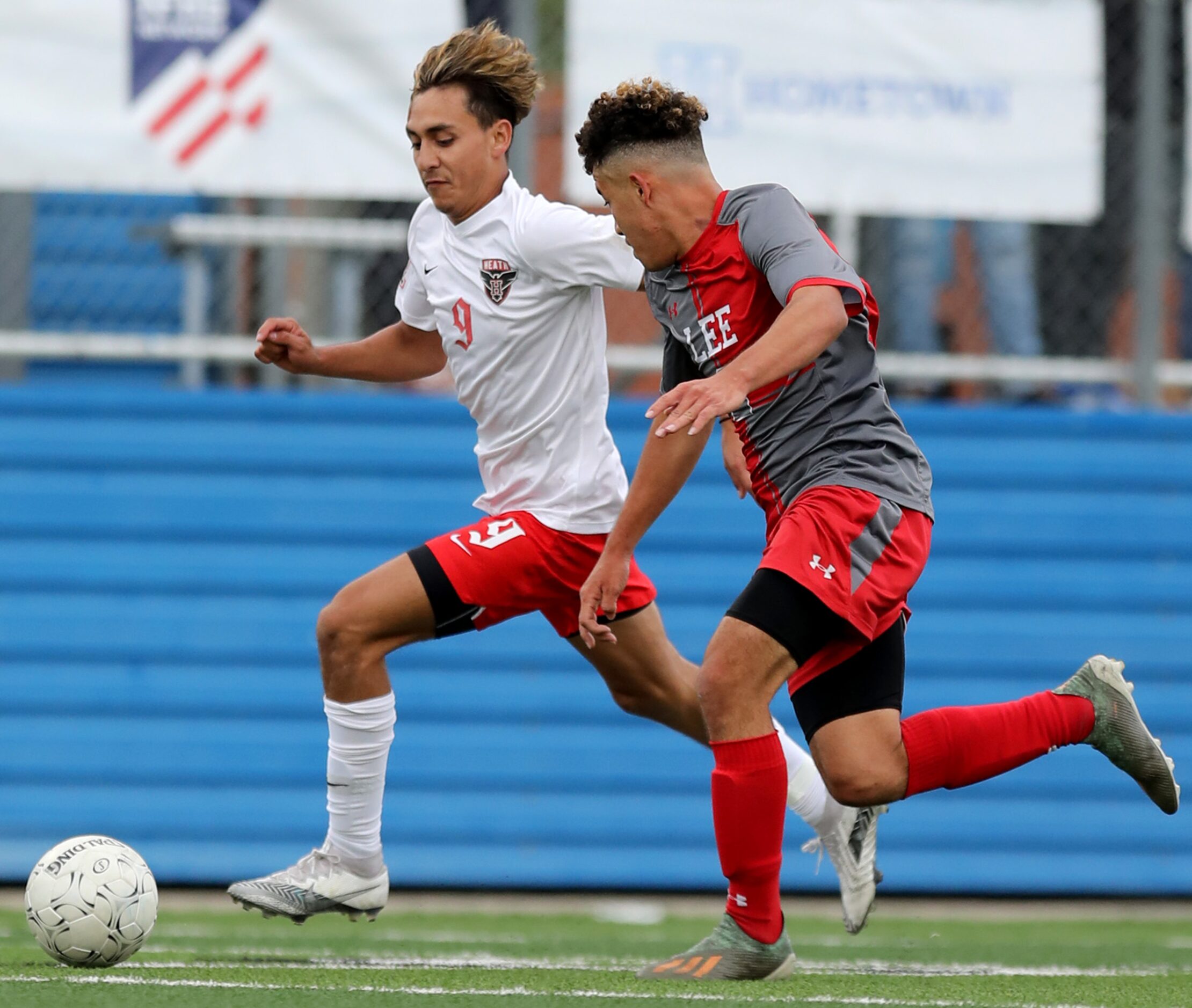 Rockwall-Heath's Chuy Ruiz (9) and SA Lee's Luis Cabrera (2) chase after the ball during...