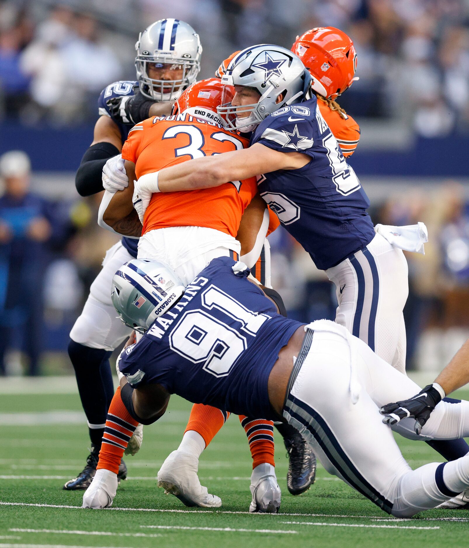 Dallas Cowboys linebacker Leighton Vander Esch (55) and defensive end Carlos Watkins (91)...