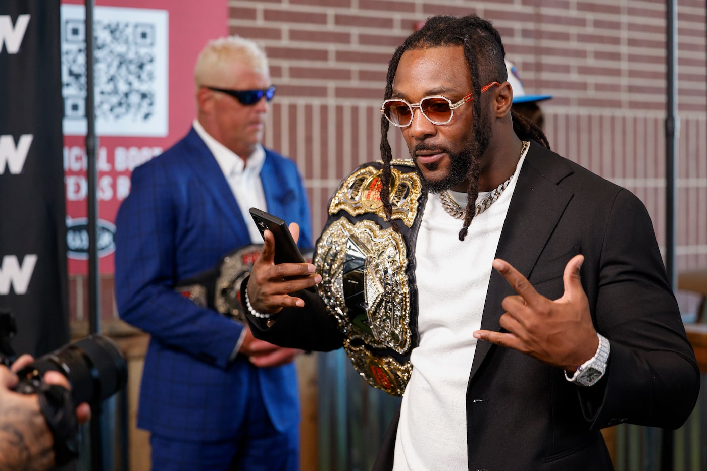 AEW world champion Swerve Strickland poses for photos after a news conference announcing a...