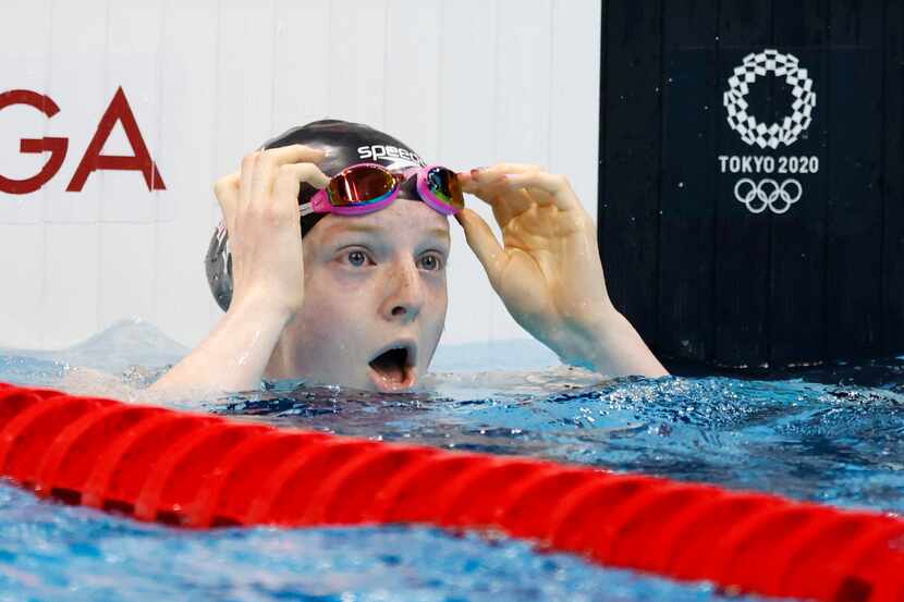 USA’s Lydia Jacoby reacts after noticing she won in the women’s 100 meter breaststroke final...