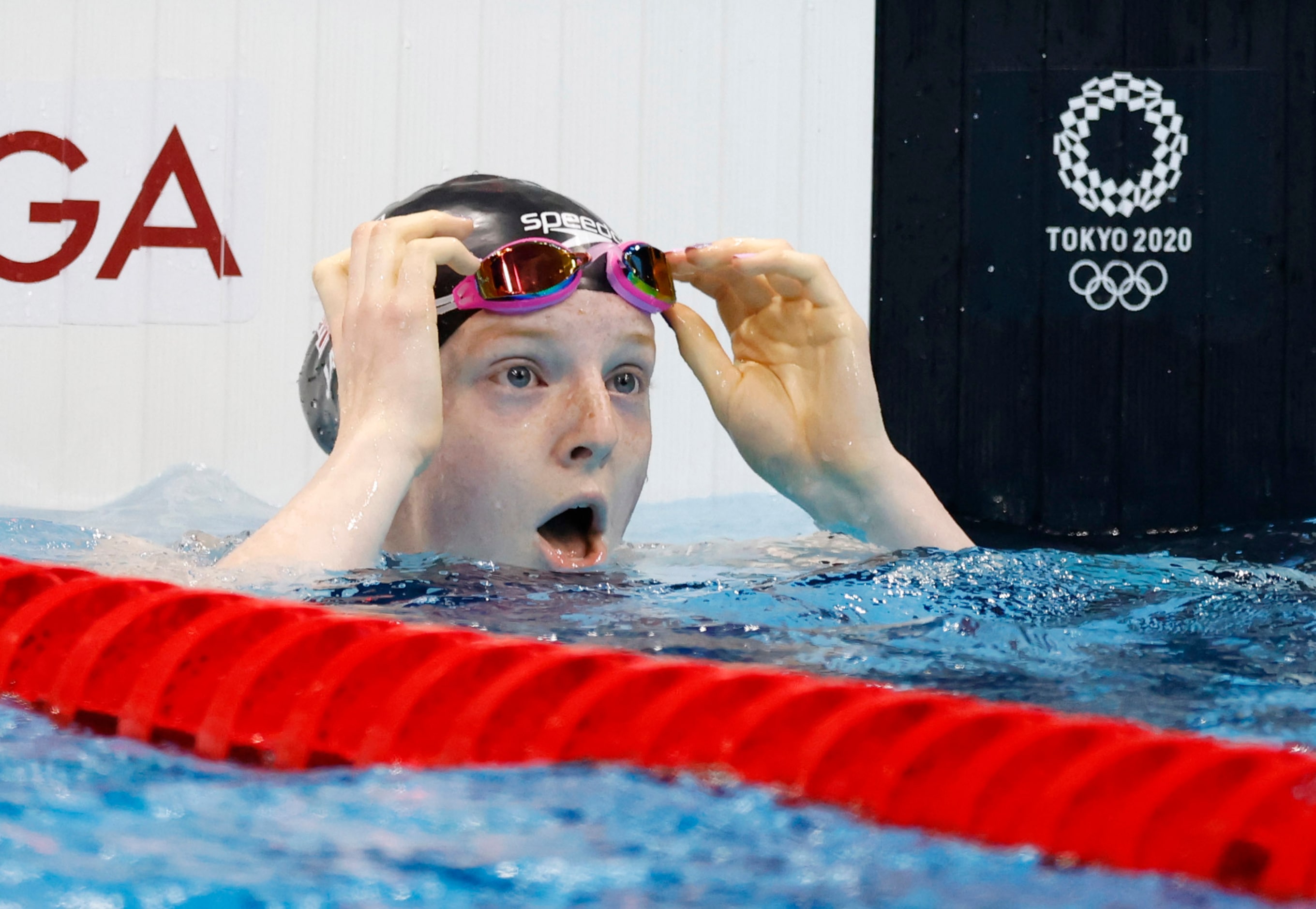 USA’s Lydia Jacoby reacts after noticing she won in the women’s 100 meter breaststroke final...