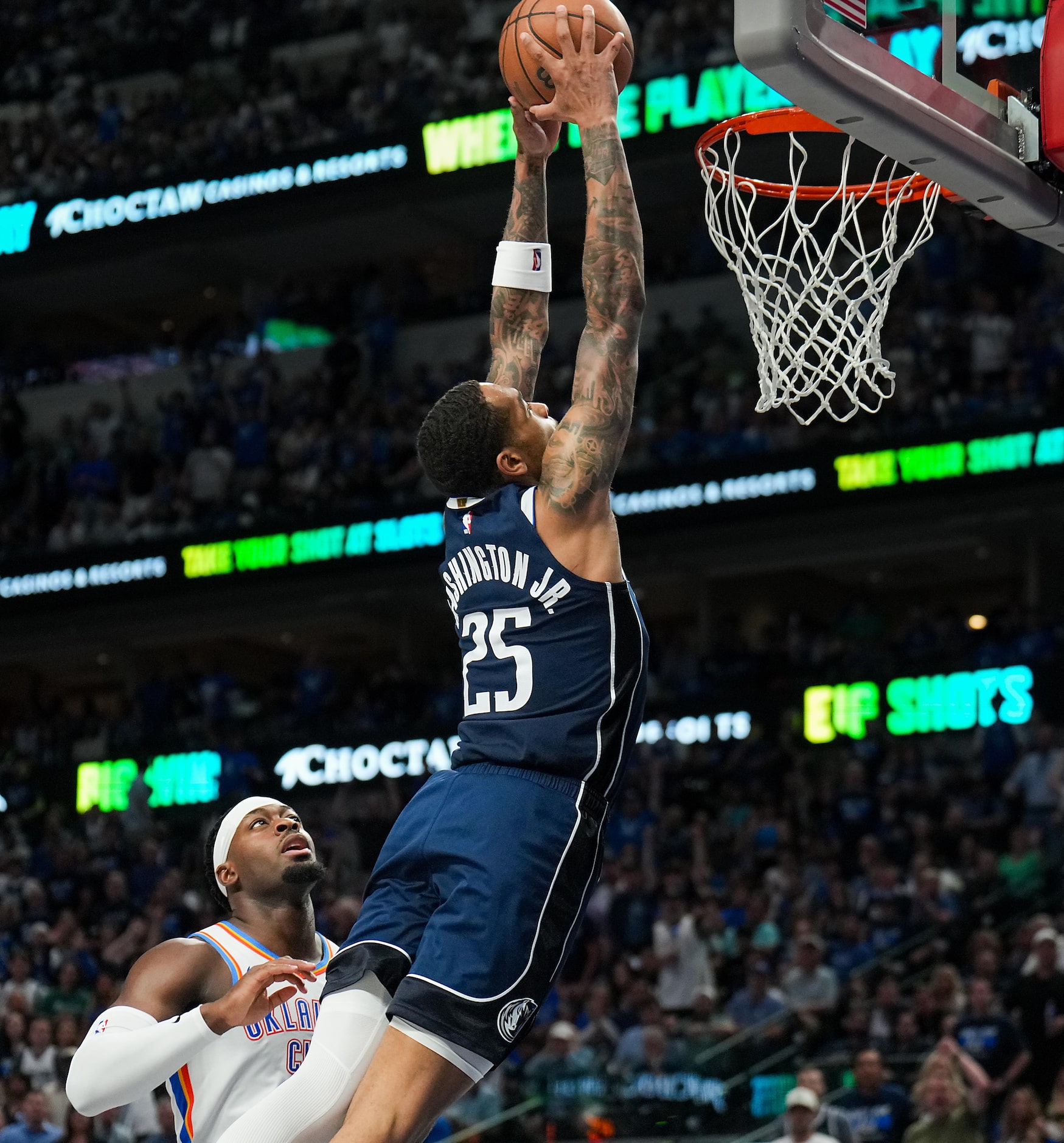 Dallas Mavericks forward P.J. Washington (25) dunks the ball past Oklahoma City Thunder...