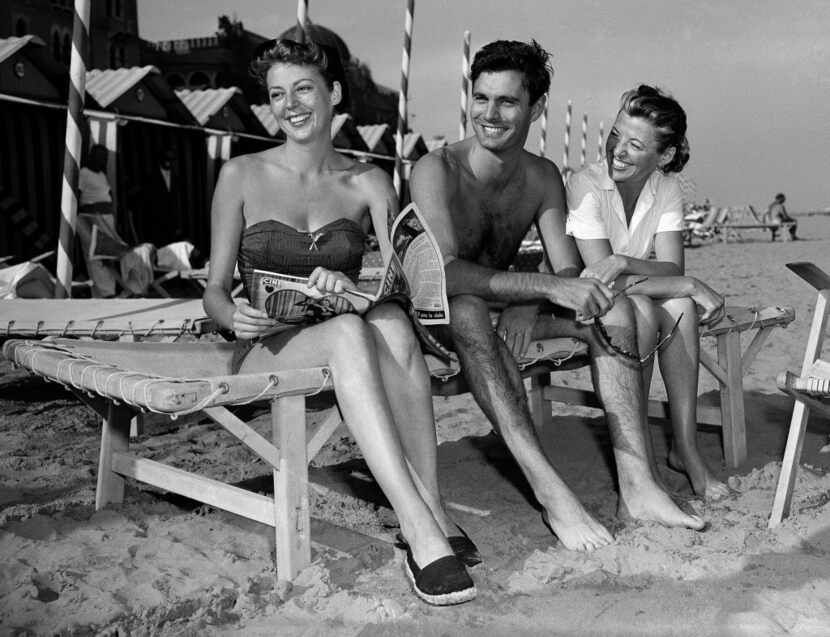 Actor Louis Jourdan sat with actress Anne Vernon (left) and his wife, Berthe Fredrique, on...