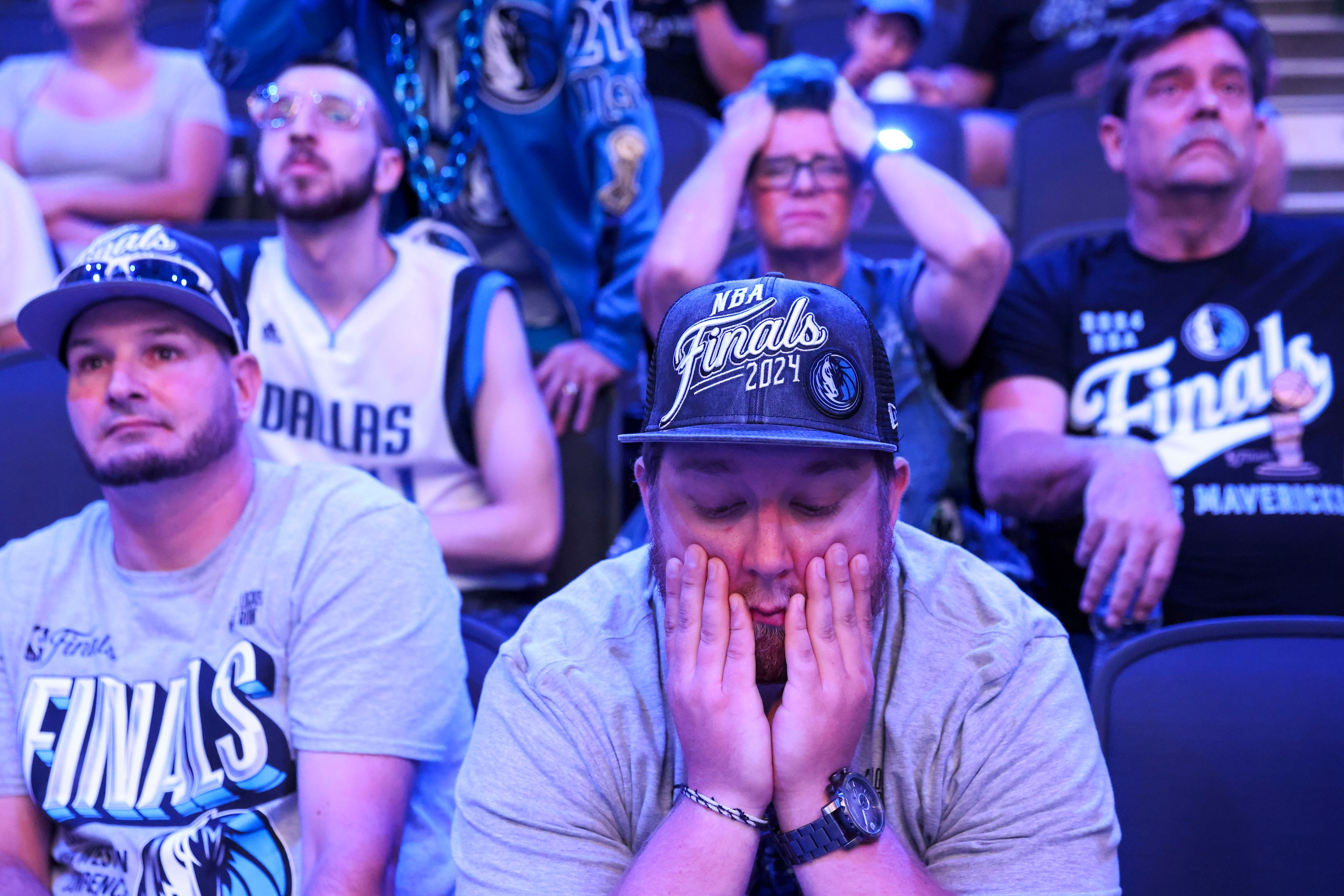 Jason Hicks (center), alongside the crowd looks dejected during a watch party after Dallas...