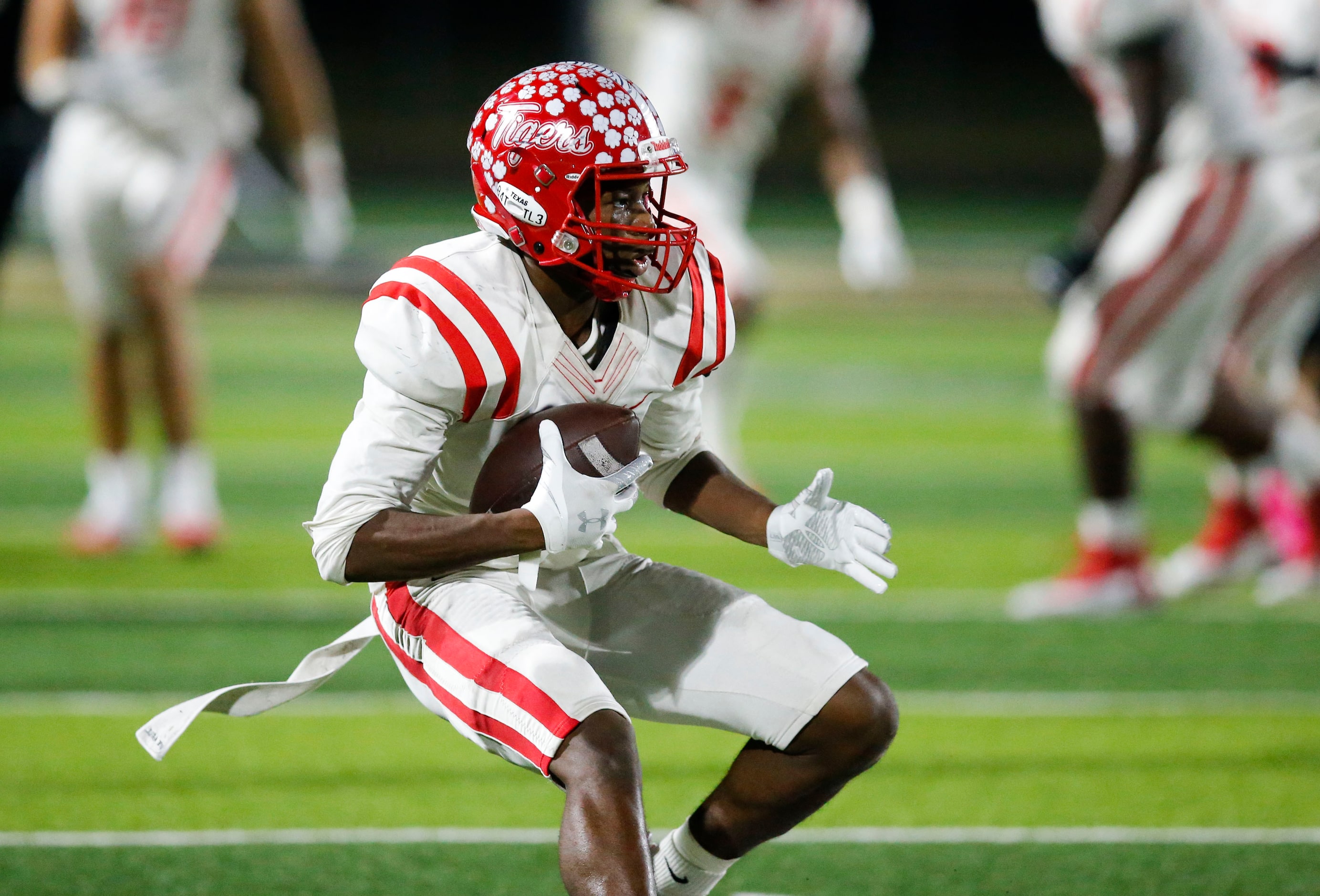 Terrell junior Kanye Nix looks for room against the Kaufman defense during the first half of...