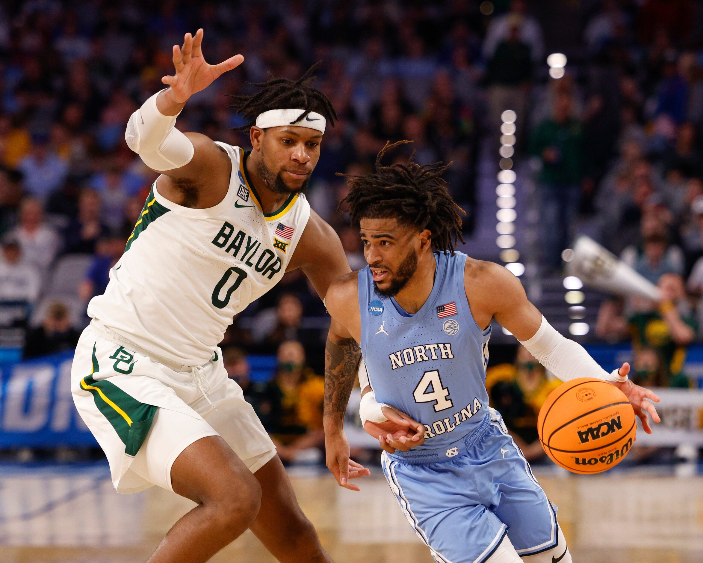 North Carolina Tar Heels guard R.J. Davis (4) dribbles around Baylor Bears forward Flo...