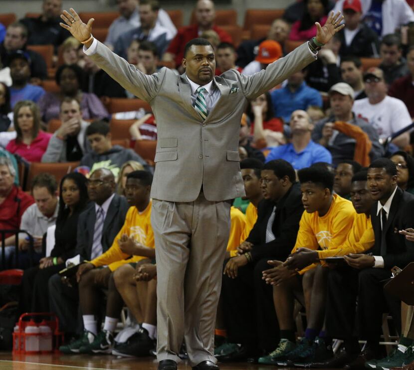 Dallas Madison head coach Roderick Johnson directs his team as they played Houston Yates...