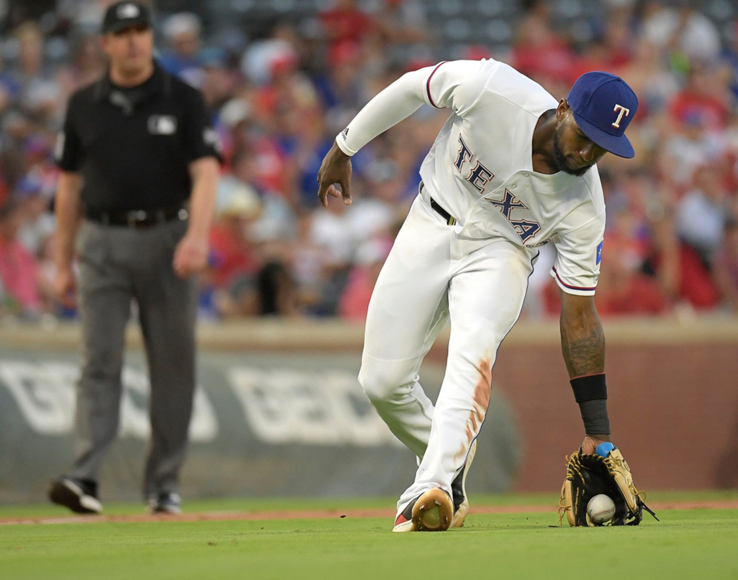 Texas Rangers third baseman Jurickson Profar (19) fields the ball but allows San Diego...