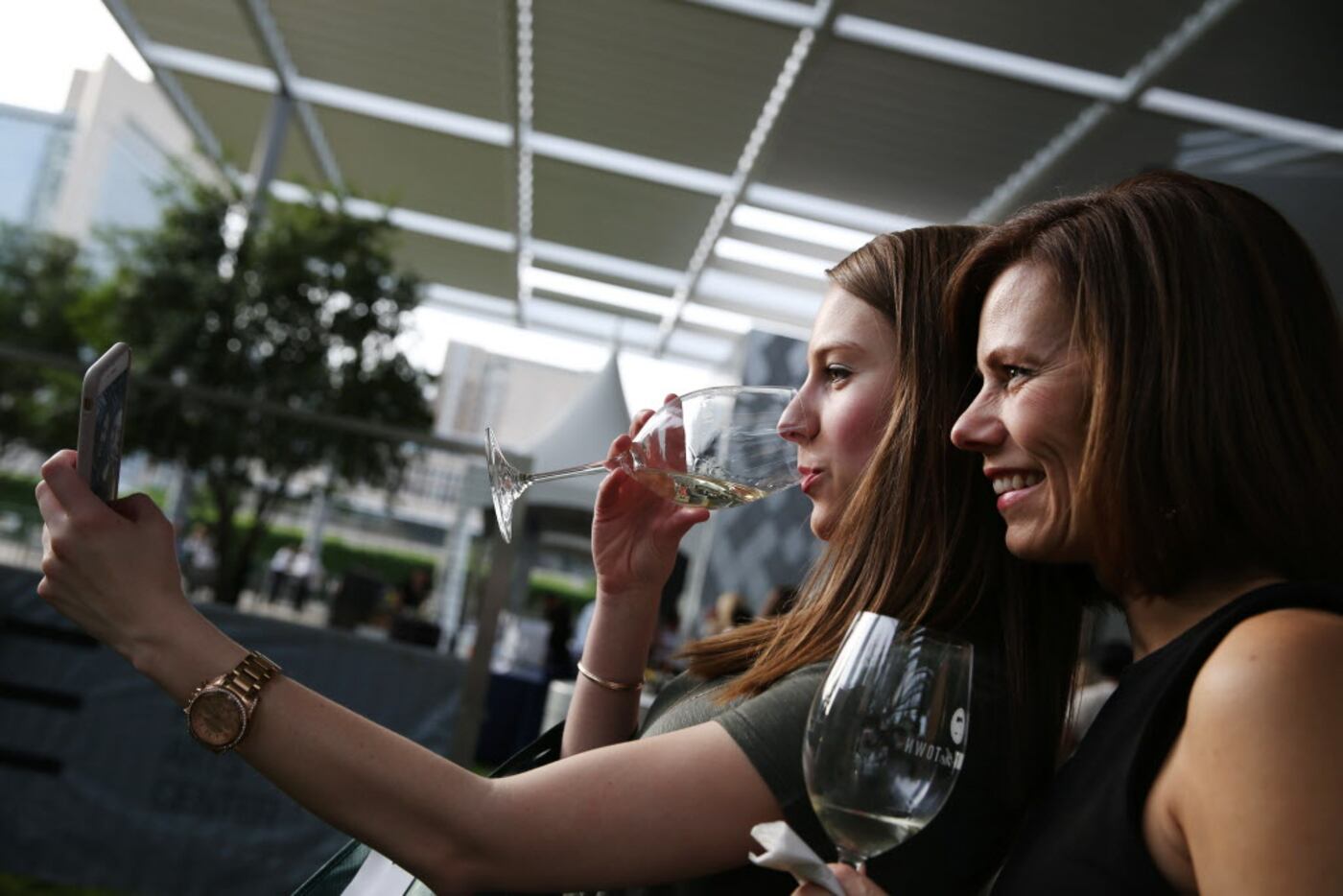 Lacey Jenison (center), of Dallas, takes a selfie with her mother, Elke Jenison, of Plano,...