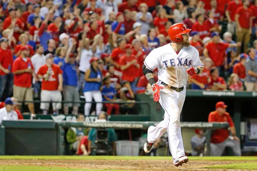 Texas Rangers left fielder Josh Hamilton (32) watches the flight of his seventh-inning...