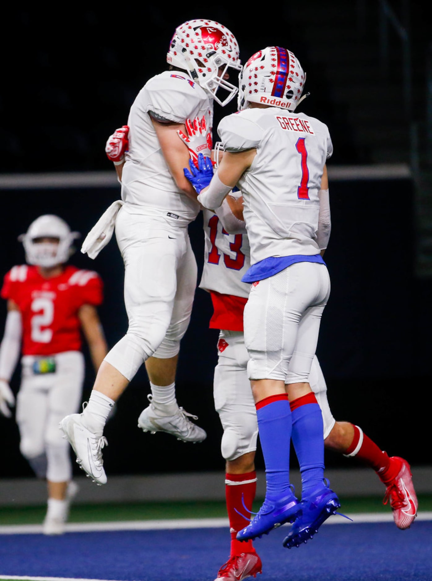 Parish Episcopal players celebrate wide receiver Gabriel WallsÃ (13) touchdown against...