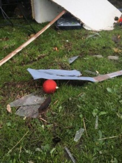  An unbroken Christmas ornament lies amid the rubble of the Santillano's home in Blue Ridge....