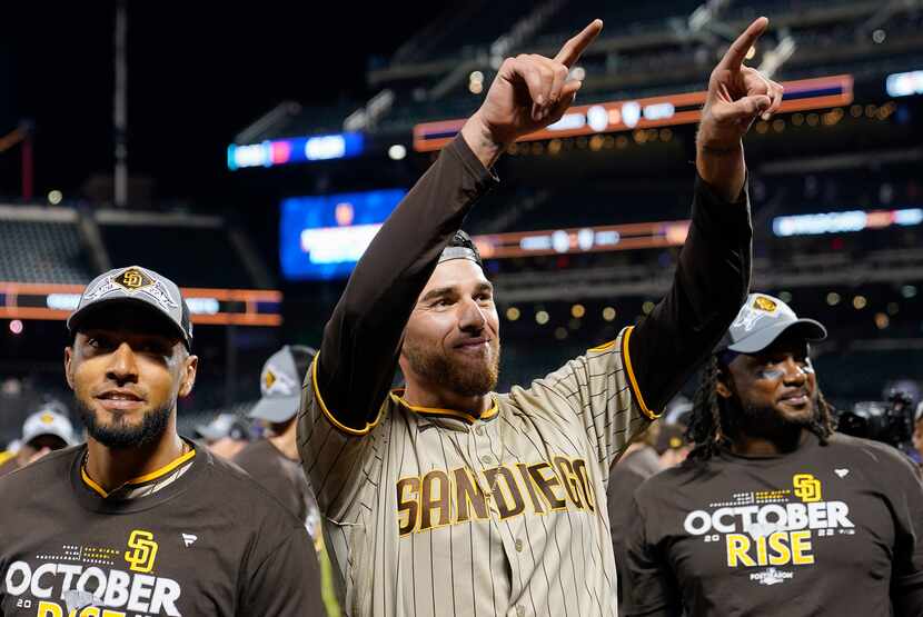 San Diego Padres starting pitcher Joe Musgrove, center, celebrates after the Padres defeated...
