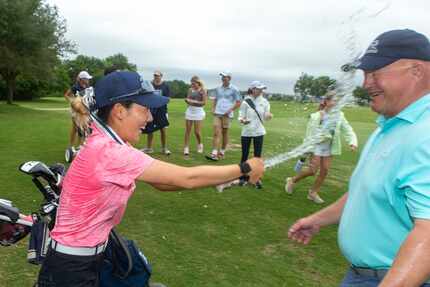 Carrollton Ranchview's Bohyun Park celebrates her third state title with head coach Kevin...