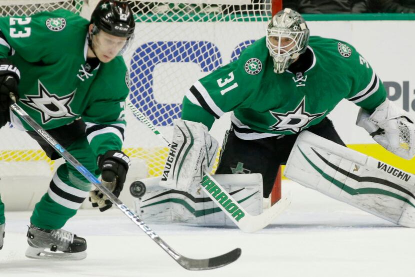 Dallas Stars goalie Antti Niemi (31) and defenseman Esa Lindell (23) defend the goal during...