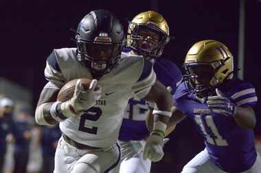 Lone Star’s Ashton Jeanty (2) runs for a touchdown in front of Denton’s Amir Fera (42) and...