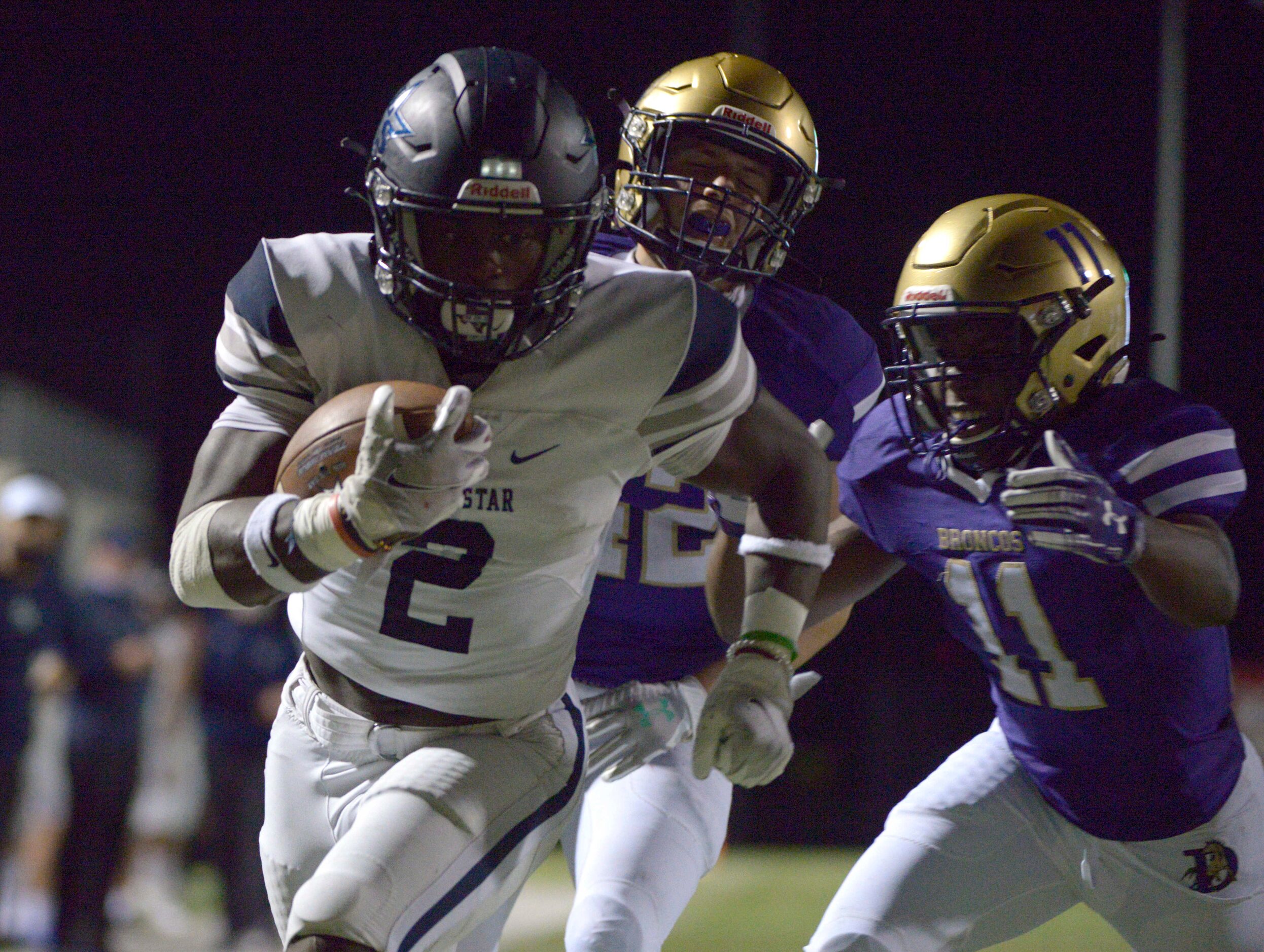 Lone Star’s Ashton Jeanty (2) runs for a touchdown in front of Denton’s Amir Fera (42) and...