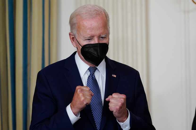 President Joe Biden reacts as House Majority Whip Rep. James Clyburn, D-S.C., speaks before...