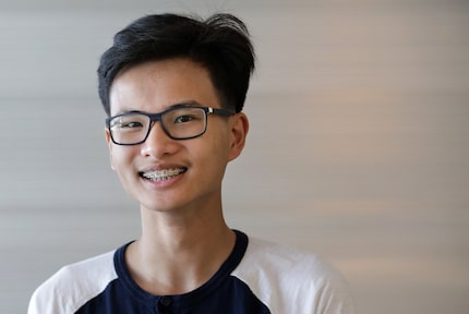 Tri Truong, 17, rehearses his Townview Center School of Health Professions graduation at the...