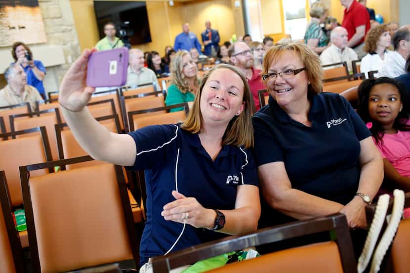 
Sara Farris (left) and Sandy McKinley, both Plano parks employees, take a photo at the new...