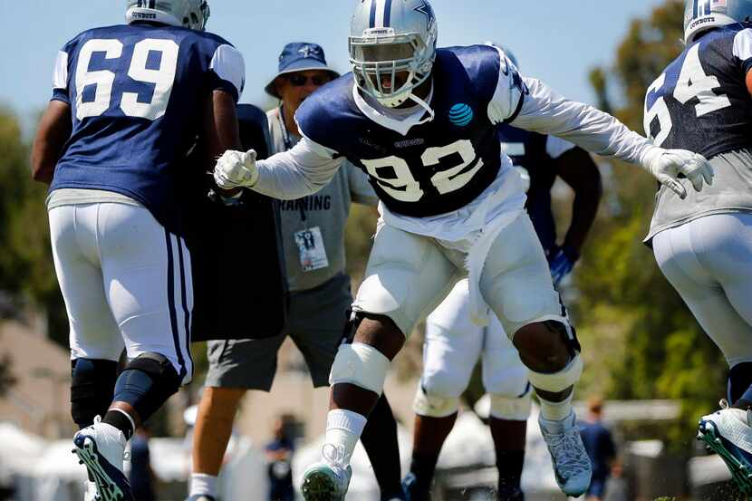 Dallas Cowboys defensive tackle Cedric Thornton (92) executes a pass rushing drill during...