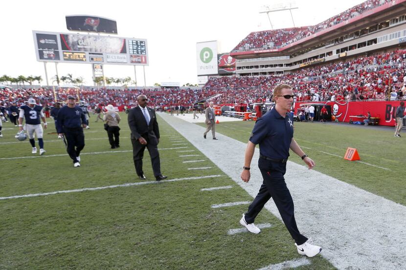 Dallas Cowboys head coach Jason Garrett walks off the field after they lost to the Tampa Bay...