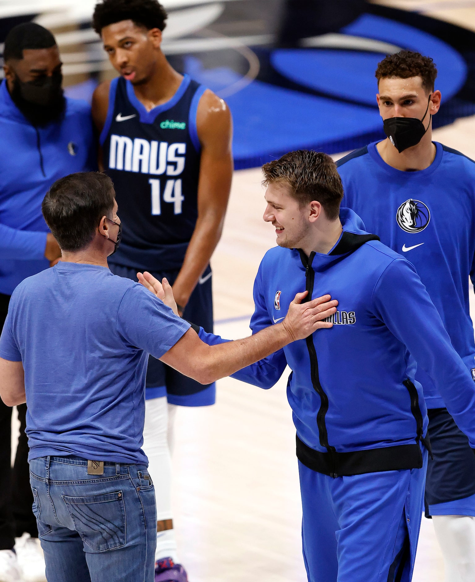 Dallas Mavericks owner Mark Cuban (left) congratulates guard Luka Doncic on his 5,000 point...