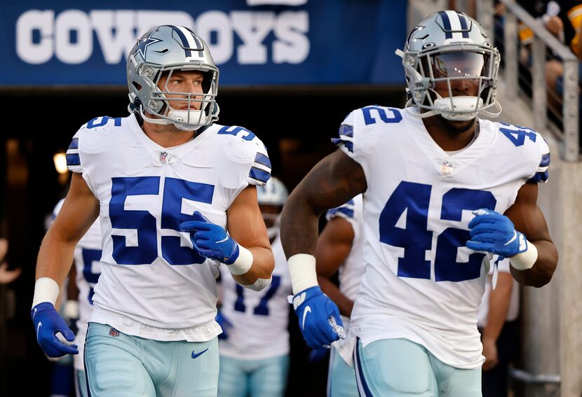 Dallas Cowboys linebackers Leighton Vander Esch (55) and Keanu Neal (42) take the field to...