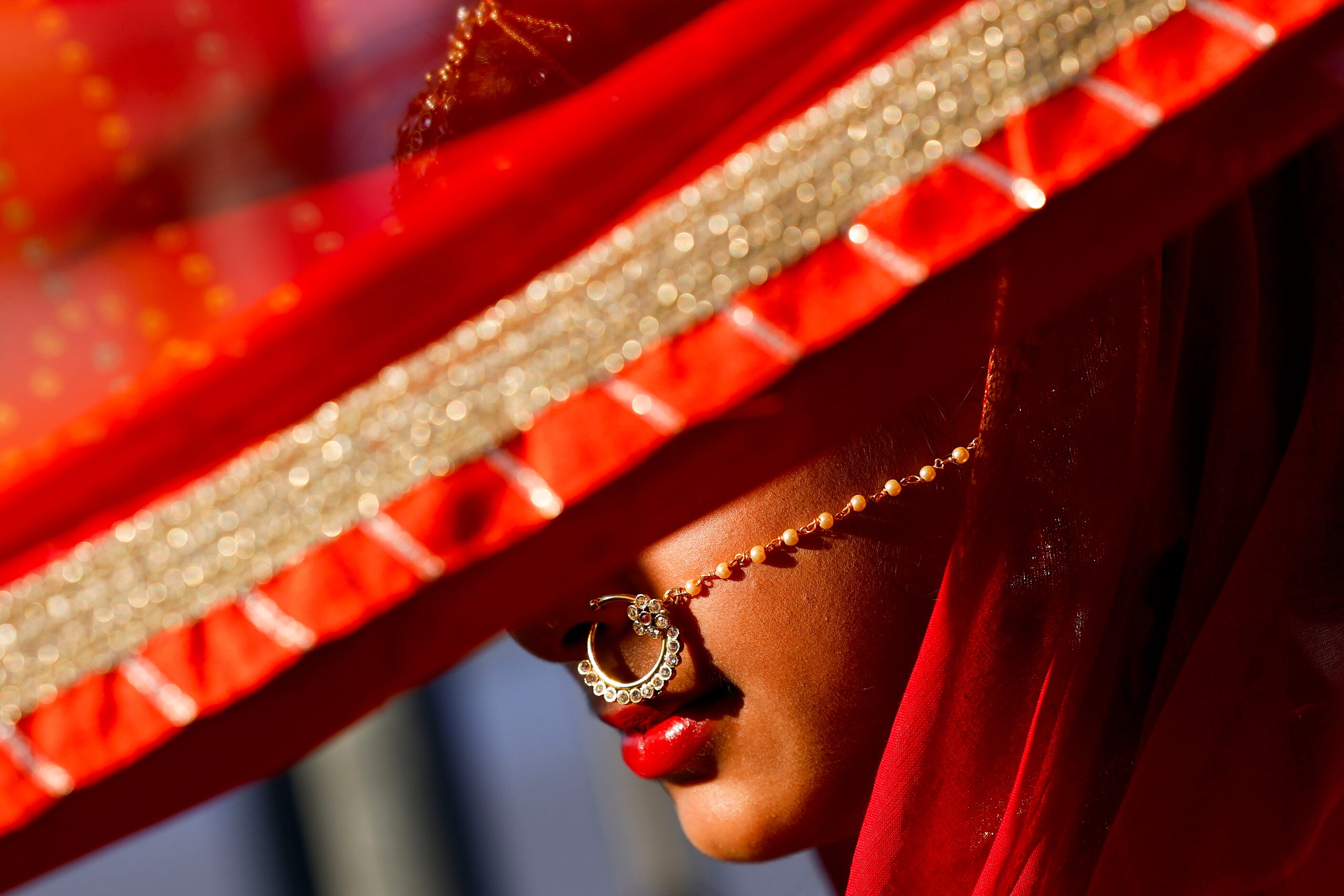 Raisa Siddique, 11, dressed with a traditional Bangladeshi bride attire, waits for her turn...