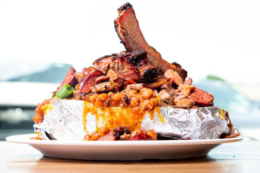The Food Coma Baked Potato:Ribs, Brisket, Sausage, Hot Links, and Baked Beans piled on top...