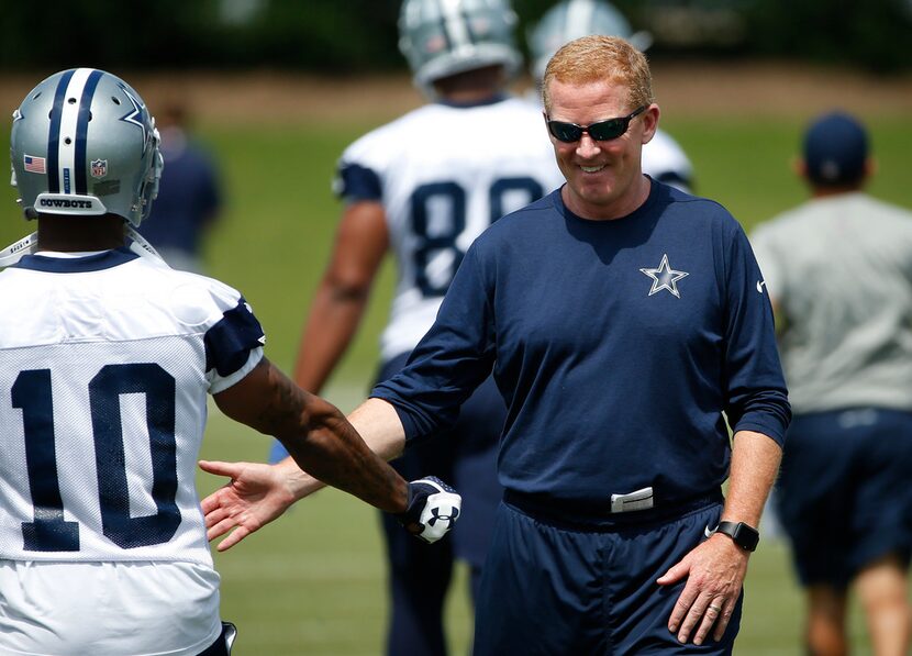 Dallas Cowboys head coach Jason Garrett greets running back Tavon Austin (10) during an...