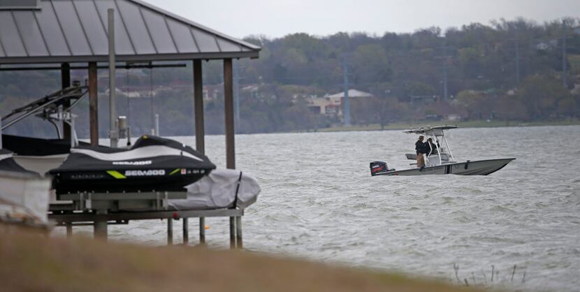 Crews from the Texas Game Warden search for a fisherman at Lake Ray Hubbard on Friday in...