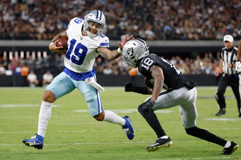 Dallas Cowboys quarterback Trey Lance (19) does his best to avoid the tackle of Las Vegas...