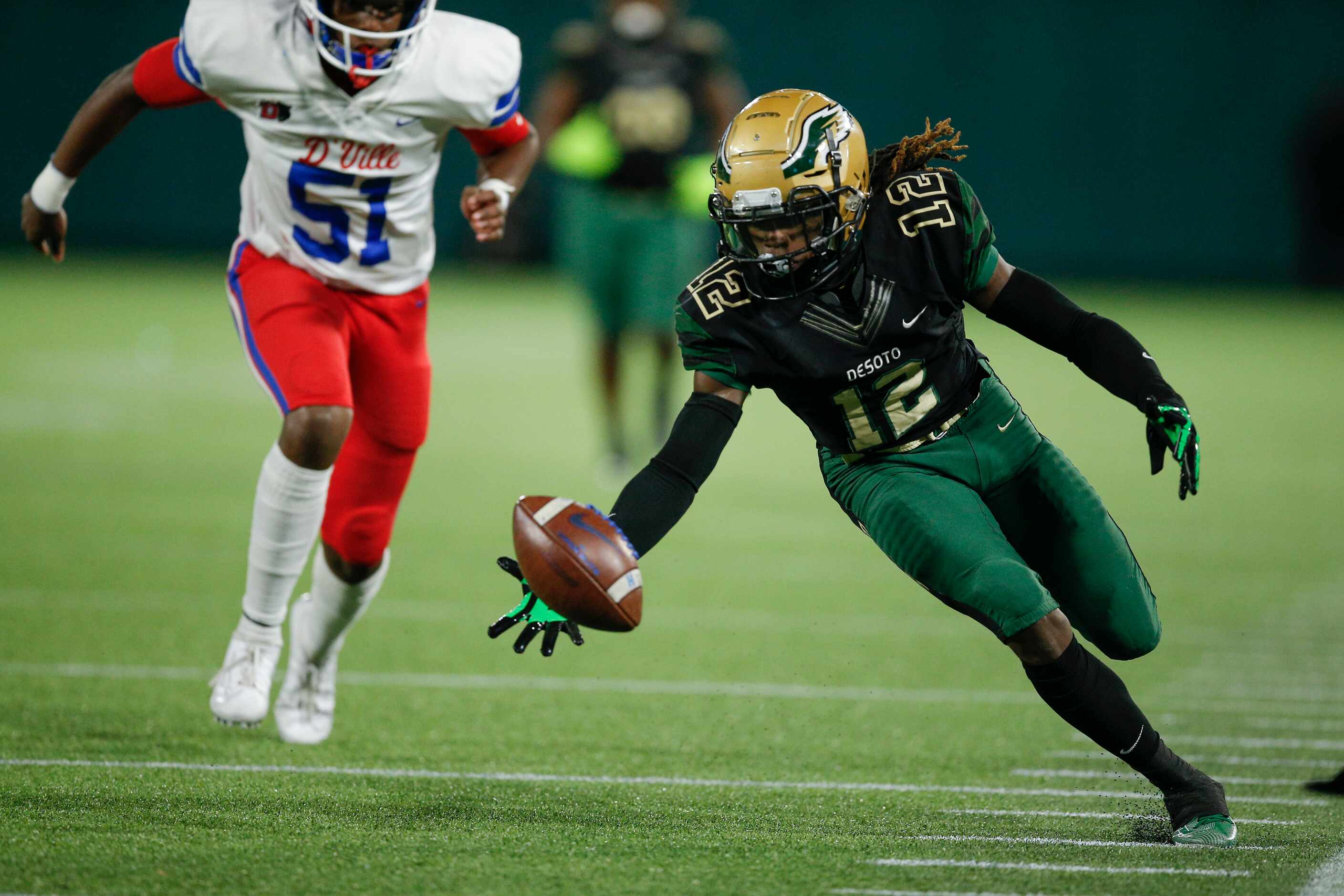 DeSoto senior Adonis Scott (12) chases down a Duncanville kick return during the first half...