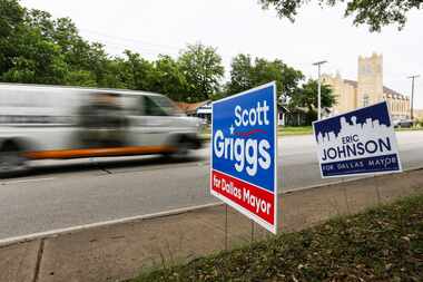 Campaign signs for candidates Scott Griggs and Eric Johnson, who are in a runoff for mayor...