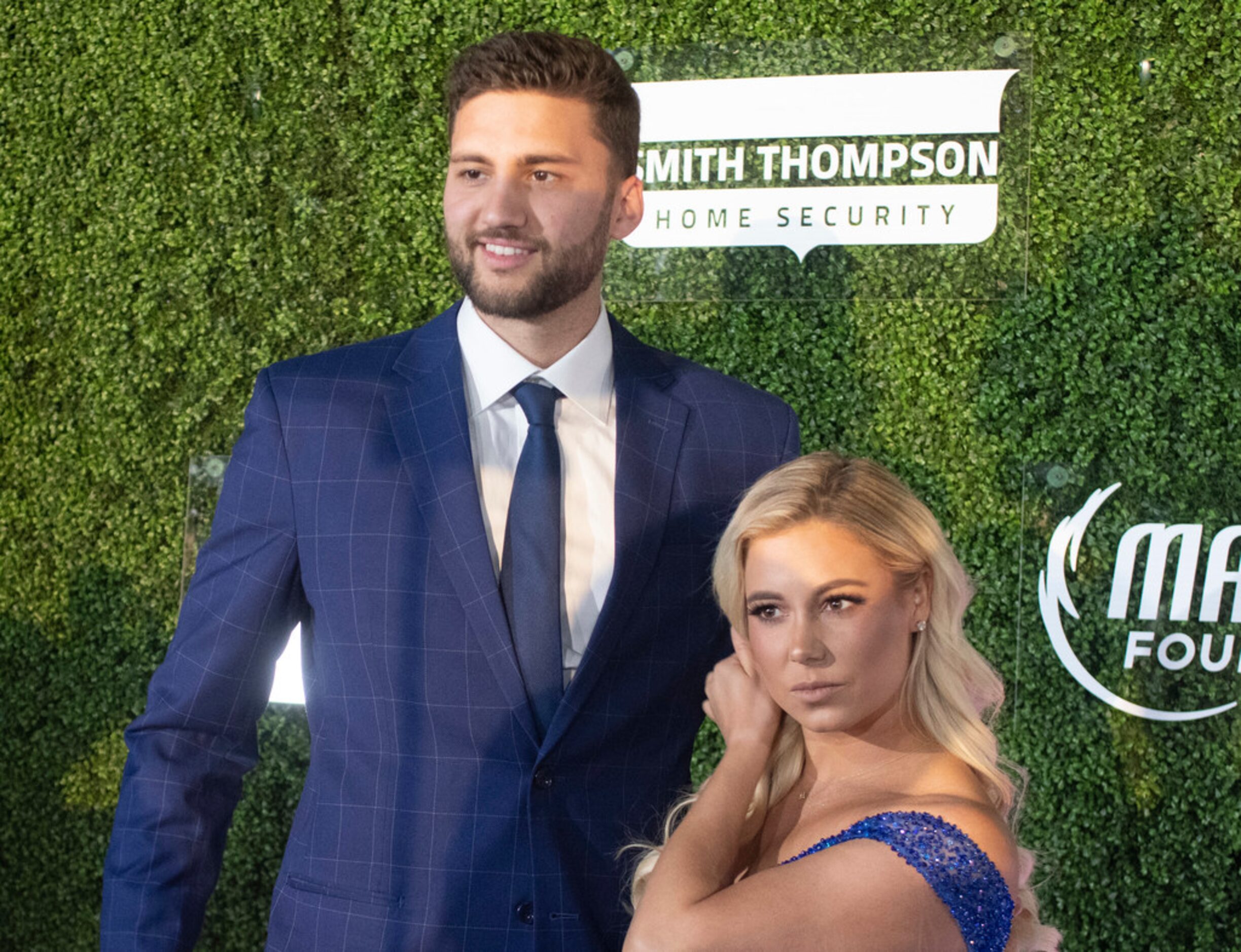 Mavs player Maxi Kleba and companion pause on the blue carpet prior to the Mavs Ball Million...