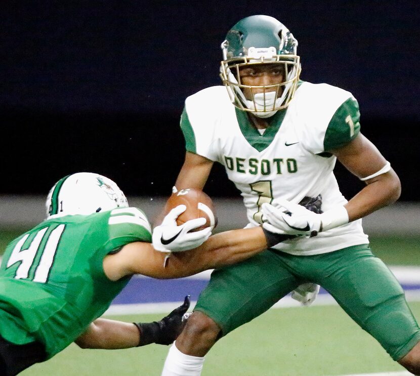 Southlake Carroll High School linebacker Michael Parrish (41) slows up Desoto High School...