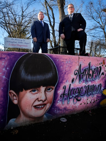 Arlington Police Sgt. Ben Lopez (left) and Det. Grant Gildon are pictured at a memorial for...