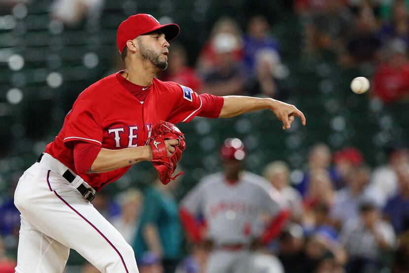 ARLINGTON, TX - SEPTEMBER 03:  Alex Claudio #58 of the Texas Rangers pitches in the ninth...