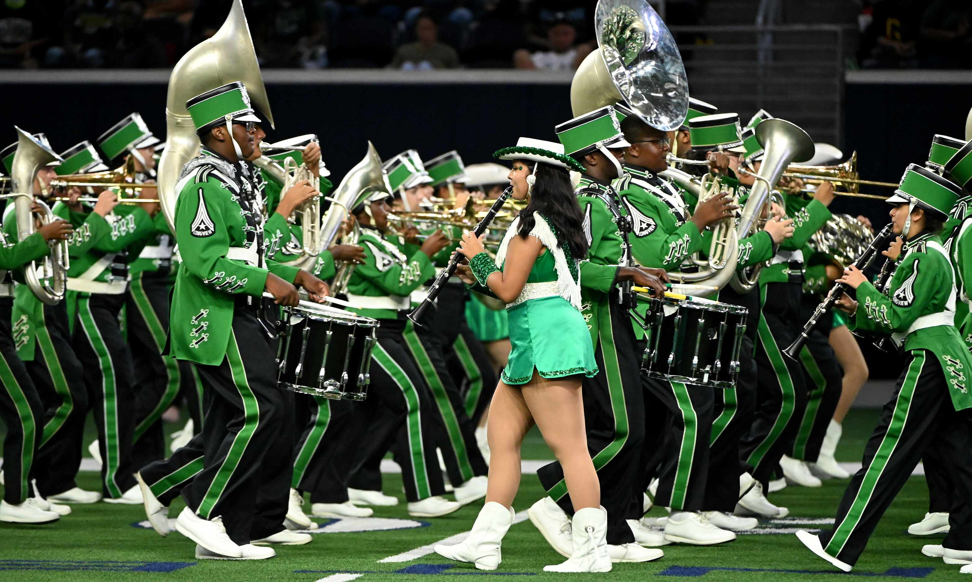 The Longview band performs during halftime of a high school football game between Longview...