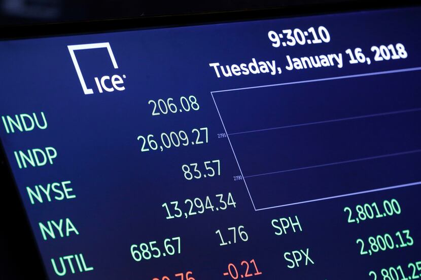 A board above the floor of the New York Stock Exchange shows the Dow Jones industrial...