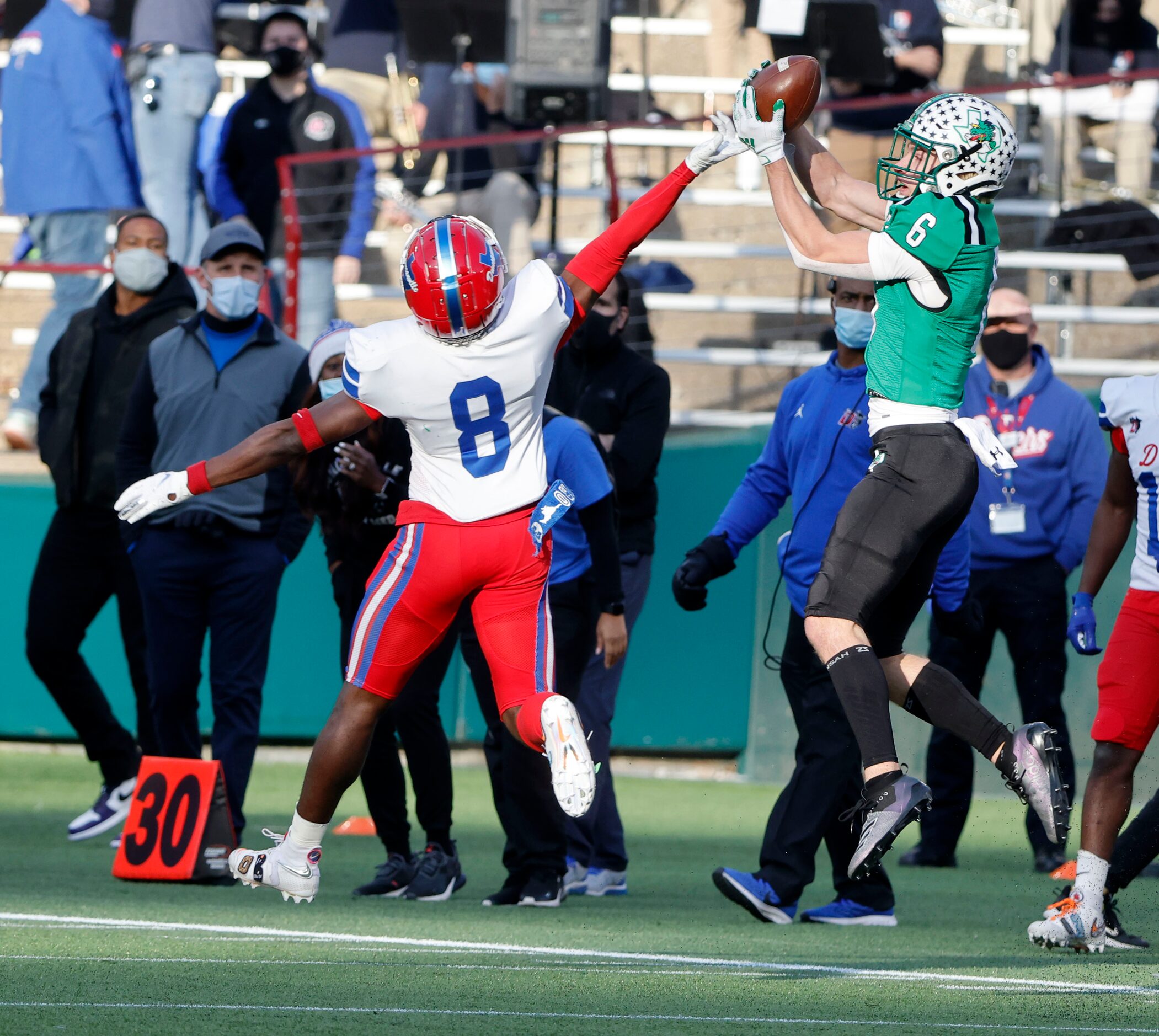 Southlake receiver Landon Samson (6) grabs a touchdown pass in front of Duncanville defender...