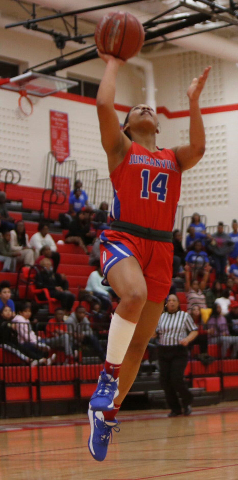 Duncanville's Kiyara Howard-Garza (14) scores on a layup during first half action against...