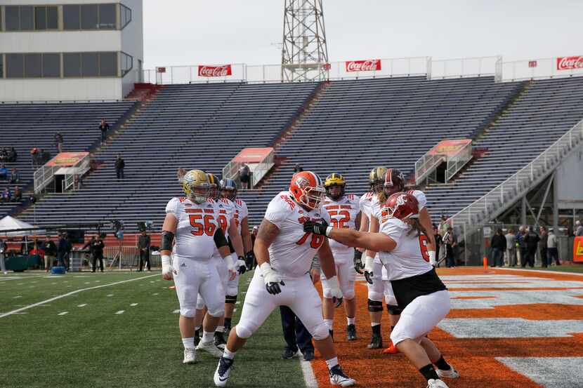 Players run drills during a North team practice ahead of Saturday's Senior Bowl in Mobile,...