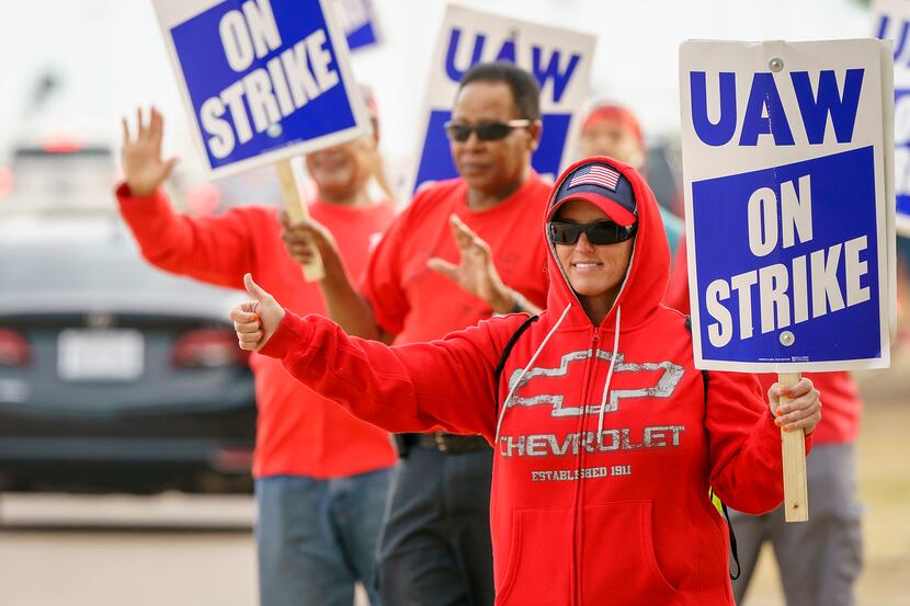 Jessica Hight joins fellow striking General Motors workers as they picket outside the GM...